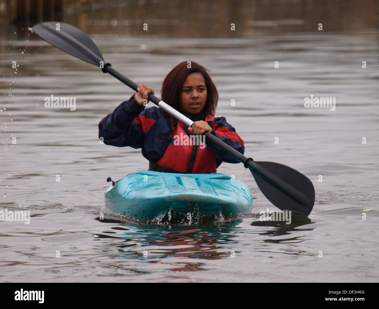 Teenage girl learning to kayak, UK 2013 Stock Photo - Alamy