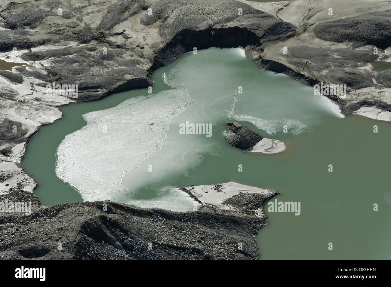 Austria / Hohe Tauern National Park - Impacts of Climate Change: glacier melting. Melting water lake beneath Pasterze glacier. Stock Photo