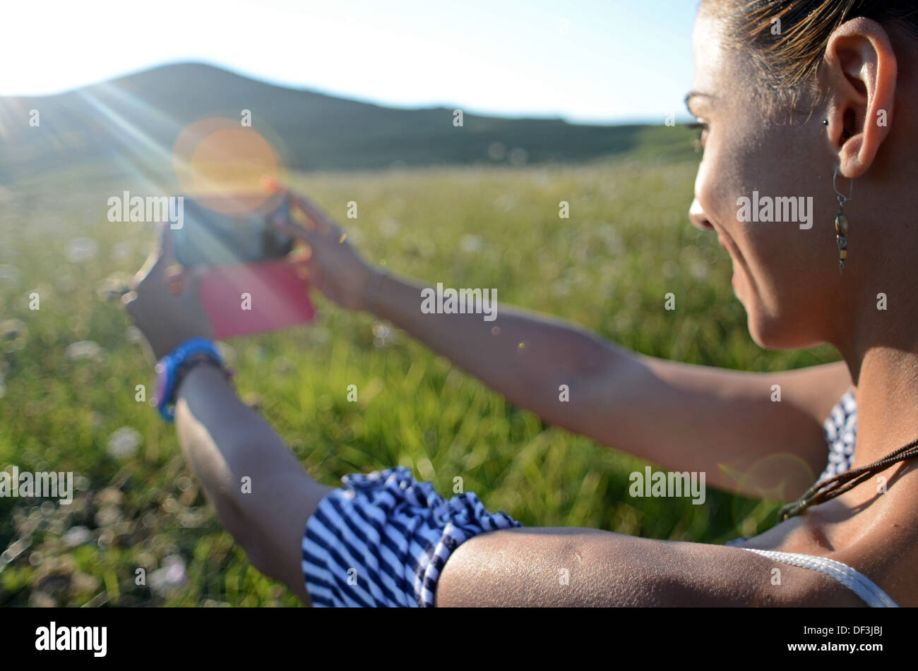 Attractive young woman takes a selfie with mobile phone Stock Photo - Alamy