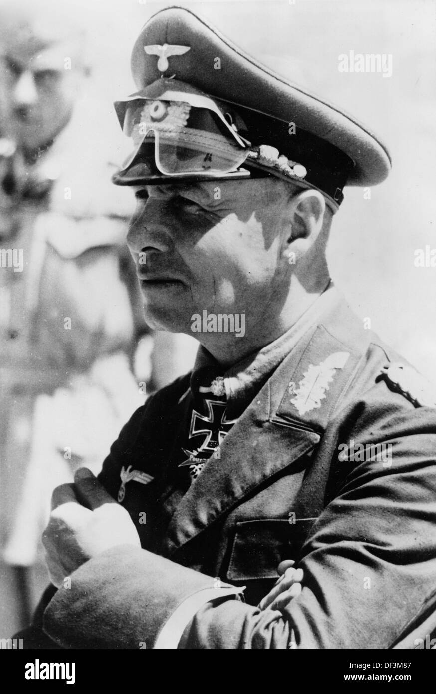 Field Marshal Erwin Rommel is decorated with the 'Knight's Cross of the Iron Cross with Oak Leaves and Swords' by Adolf Hitler on 20 January 1942. Place unknown. The Nazi Propaganda! on the back of the image is dated 21 January 1942: 'A Knight's Cross of the Iron Cross with Oak Leaves and Swords for General Rommel. The Führer and Supreme Commander of the Armed Forces awarded the General of the Tank Division Rommel, Commander of the Tank Division Afrika, with the Knight's Cross of the Iron Cross with Oak Leaves and Swords on 20 January 1942. Our image shows: General Rommel.' Photo: Berliner Ver Stock Photo