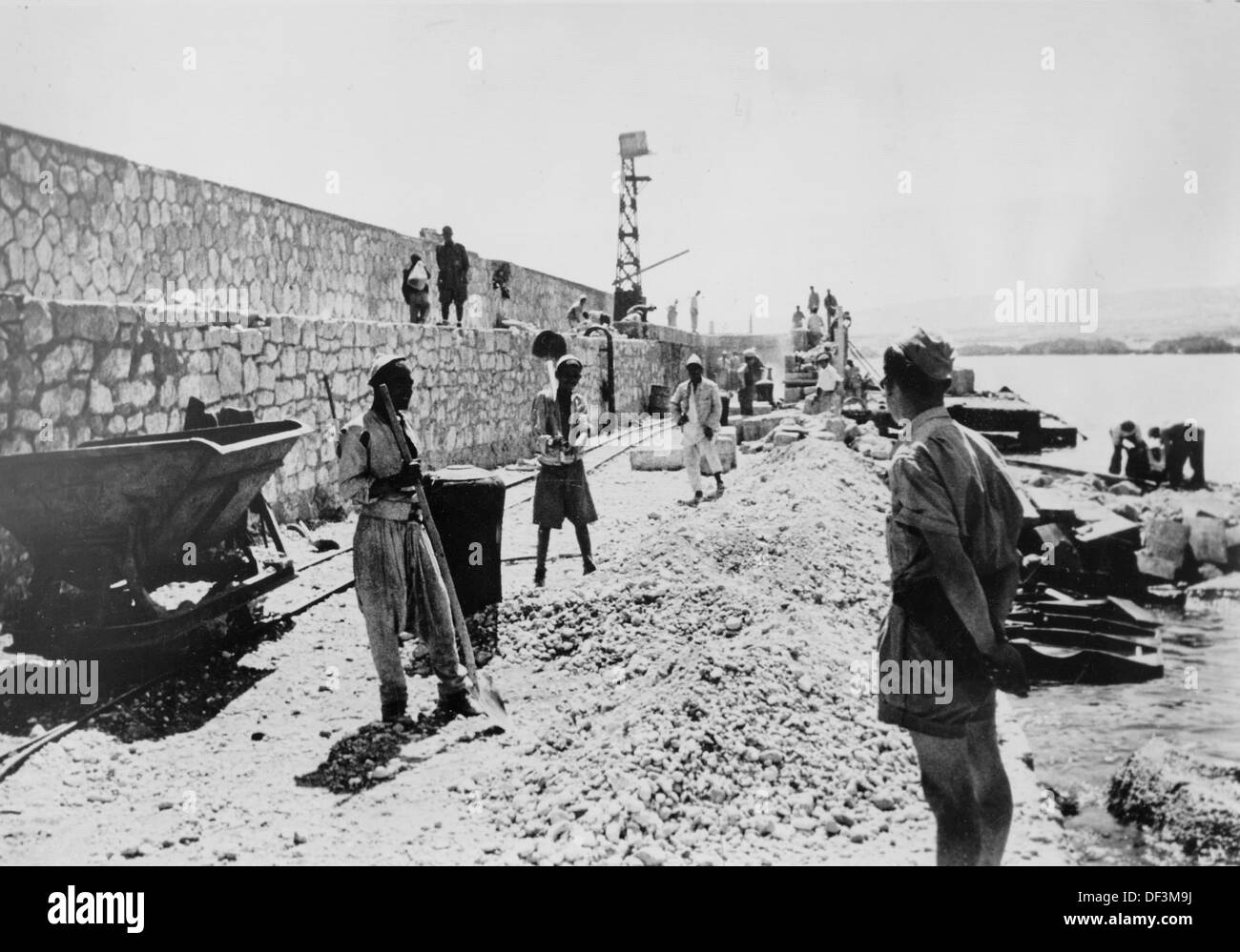 The image from the Nazi Propaganda! depicts locals working under the supervision of the Italian army to repair the port of Darna, Libya, published 19 May 1942. Fotoarchiv für Zeitgeschichte Stock Photo