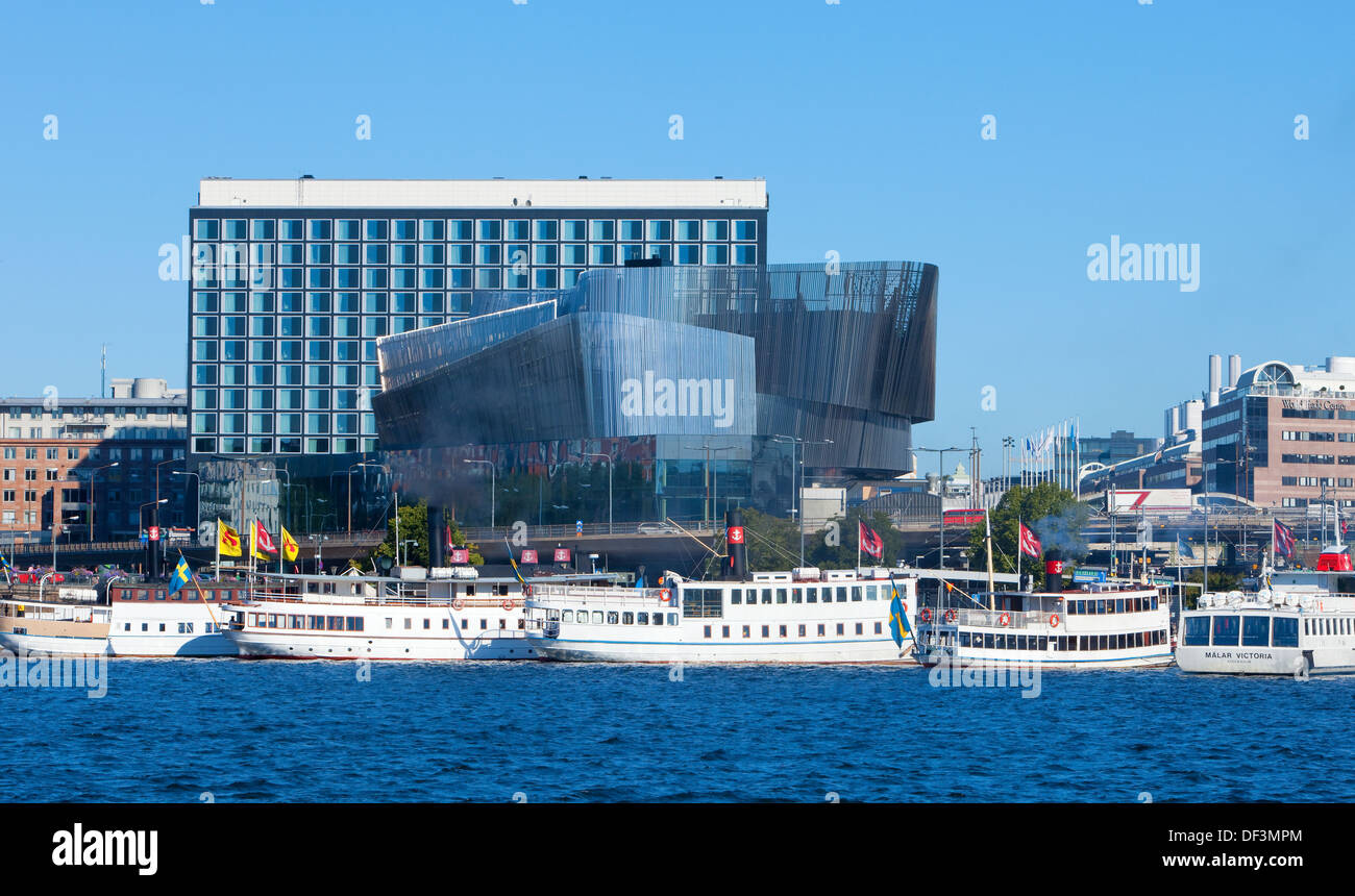 Sweden, Stockholm - Waterfront Congress Centre and steamboats. Stock Photo