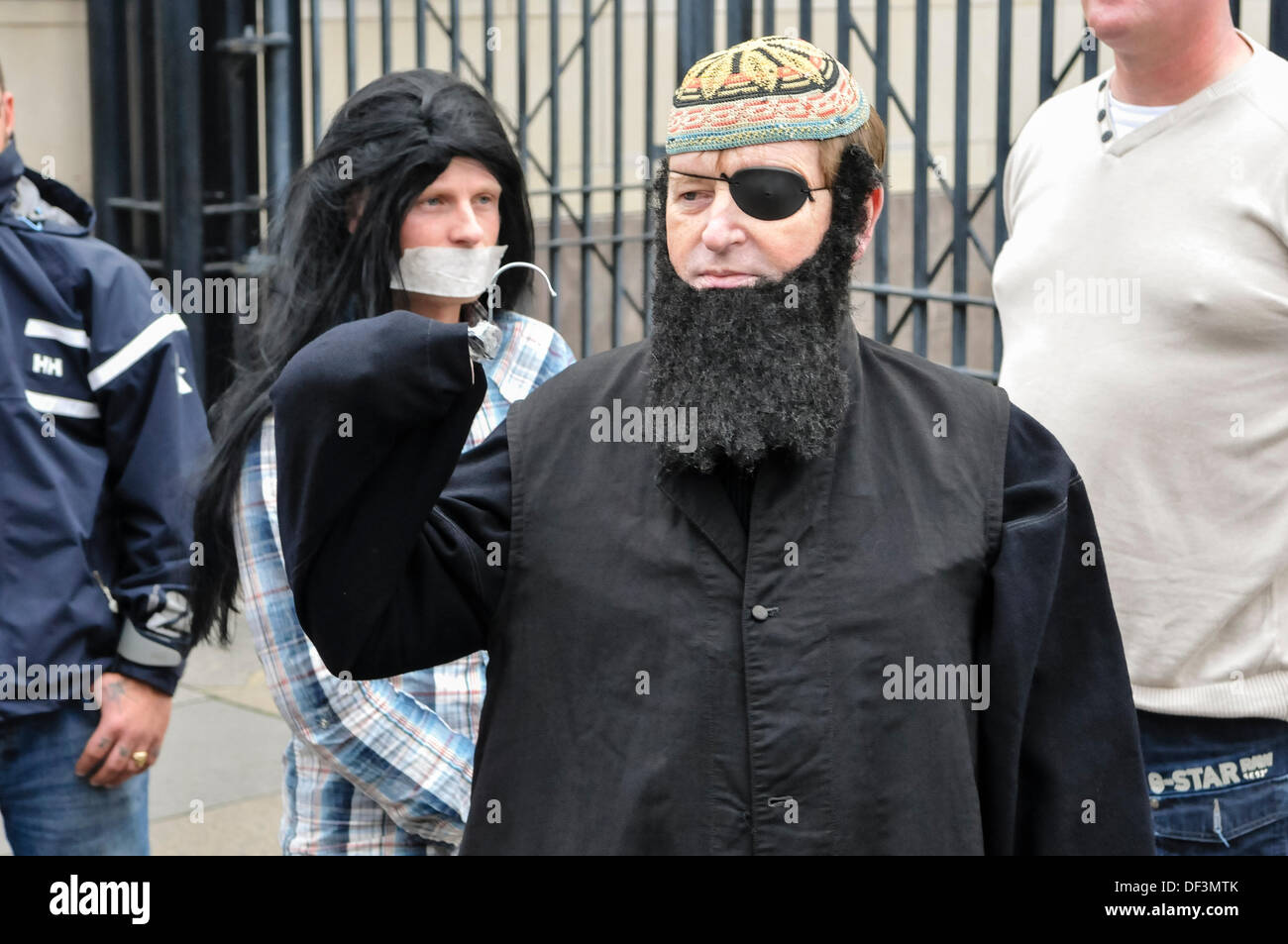 Belfast, Northern Ireland, 27th September 2013 - Protestant Coalition founder member Willie Frazer appears in court dressed as Abu Hamza. He is protesting that he is being charged under legislation aimed at curbing "infamous Muslim hate preachers". Credit: Stephen Barnes/Alamy Live News Stock Photo