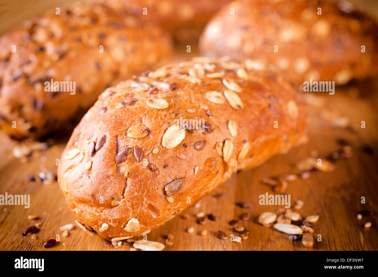 Small whole grain breads. Selective focus on the front bread Stock Photo