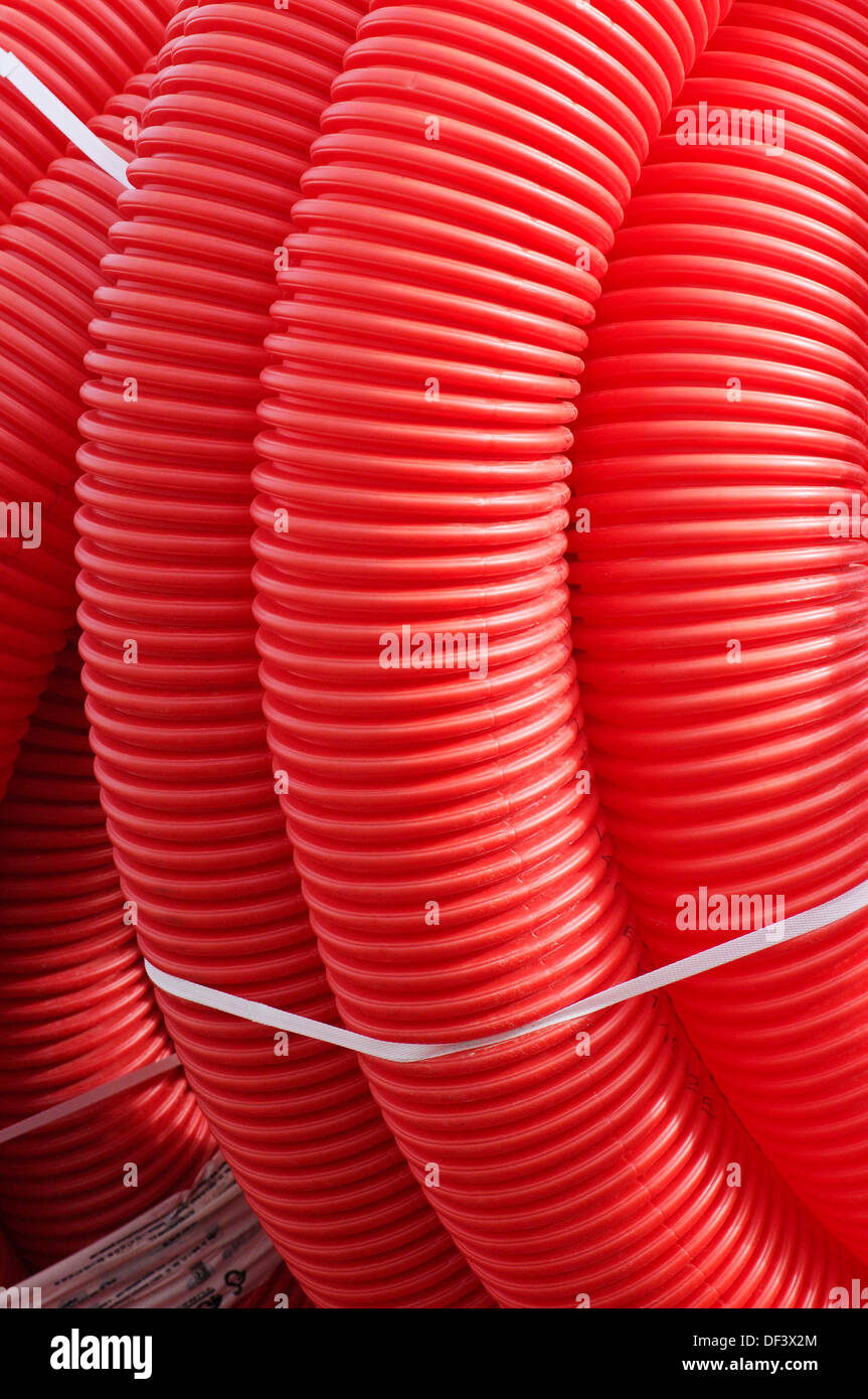 Red plastic tubing for construction Stock Photo Alamy