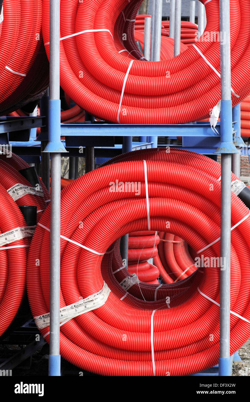 Red plastic tubing for construction Stock Photo - Alamy