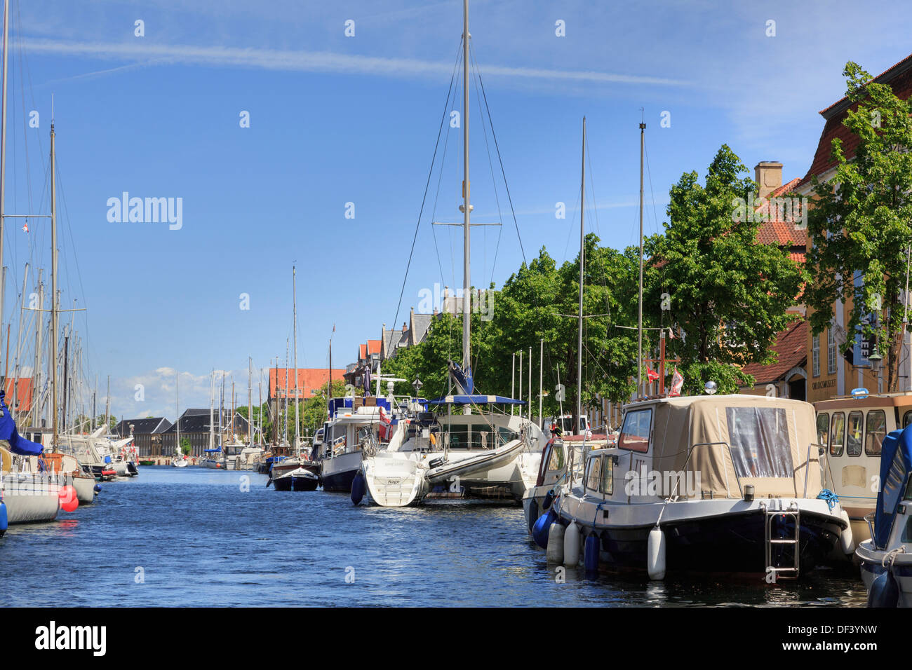 Moored yachts, boats and leisurecraft on Christianshavns Kanal, Overgaden, Christianshavn, Copenhagen, Zealand, Denmark Stock Photo