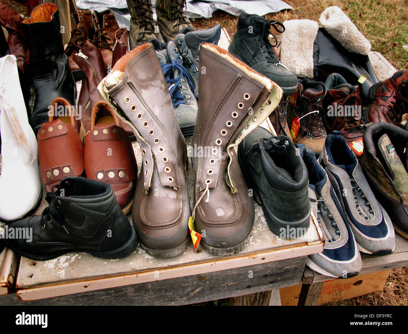 Used shoes for sale at public flea market Stock Photo Alamy