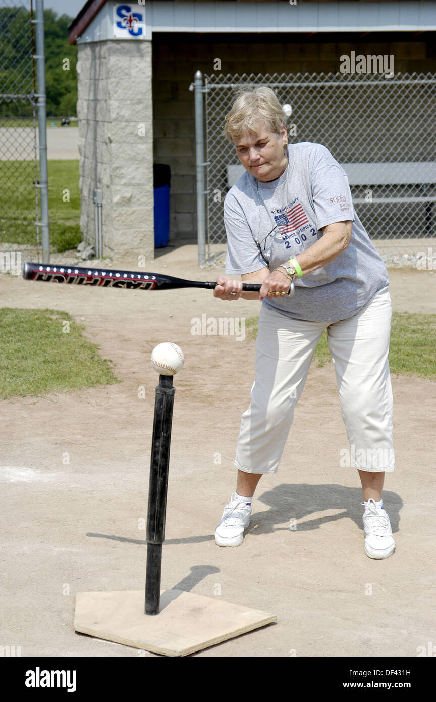 Senior participate in hitting softball off of a tee, Senior Olympics. St. Clair County, Michigan