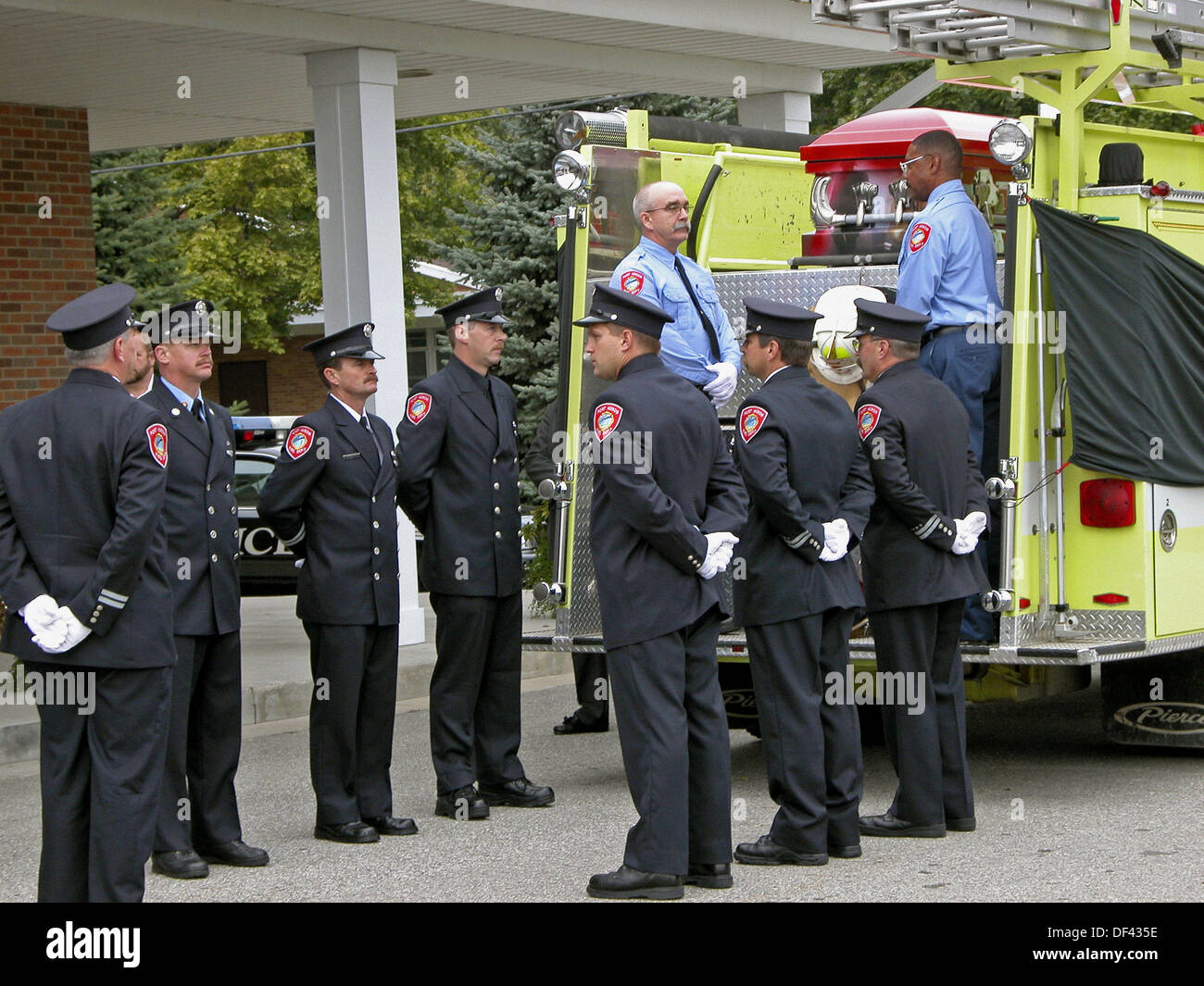 Funeral procession for a fire chief a fire engine acted as hearse