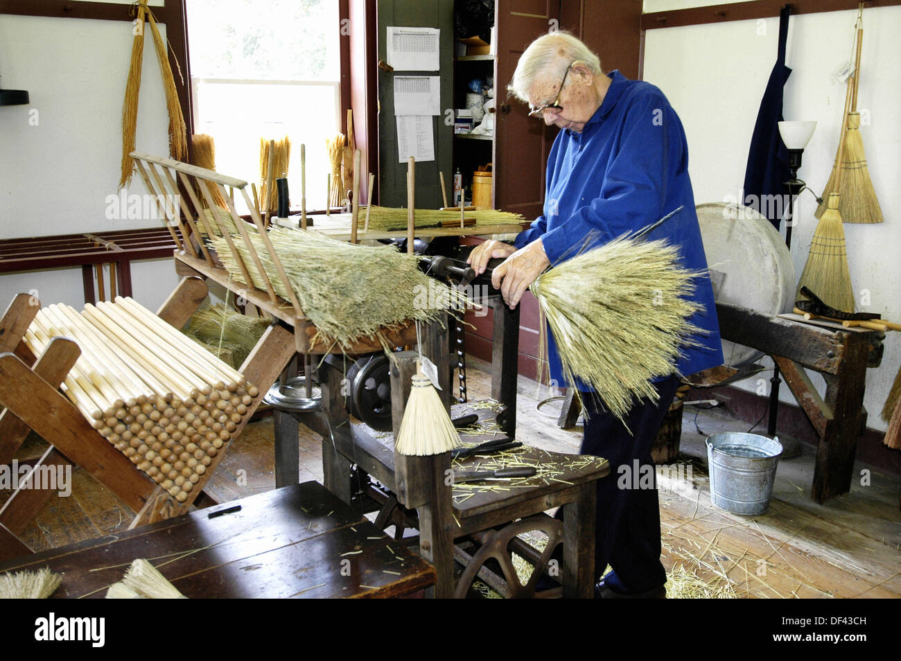 Making brooms for sale from special local straw at Historic Shaker