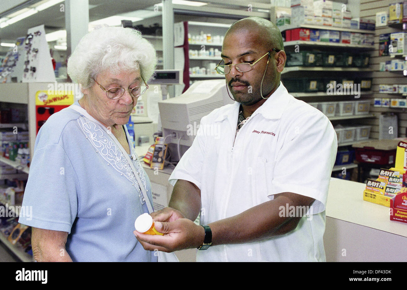 Pharmacist explains medicine to patient Stock Photo Alamy