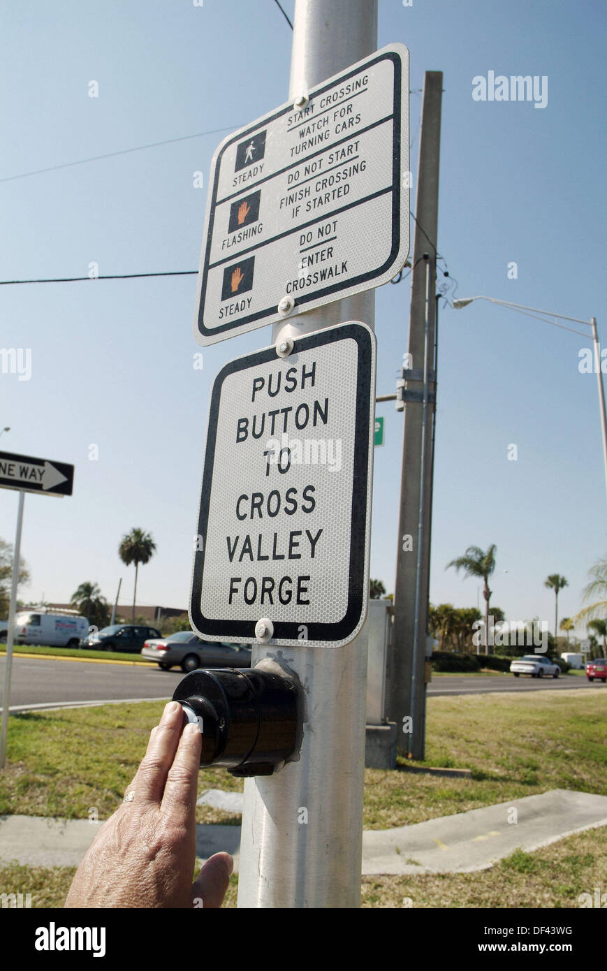 Instructions and directions on how to cross the street at a busy