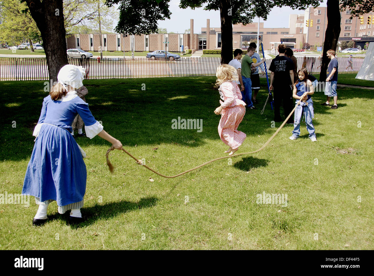Children play jump rope Circa 1700 reenactment of the Colonial period