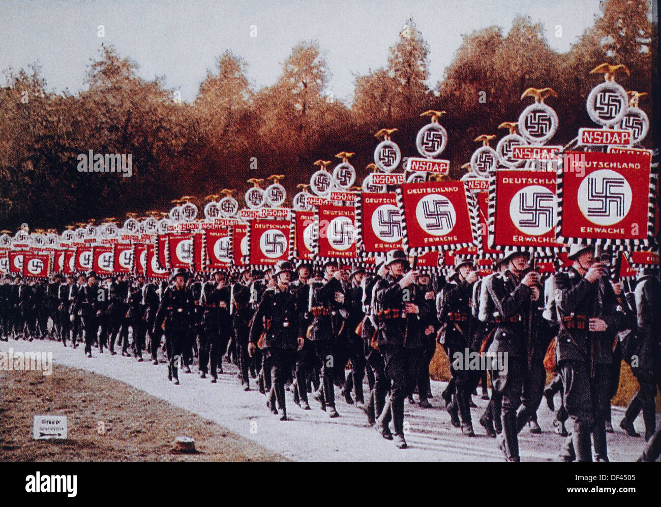 German SS Troops Bearing Standards March in Zeppelin Field, Nurnberg, Germany, 1933 Stock Photo