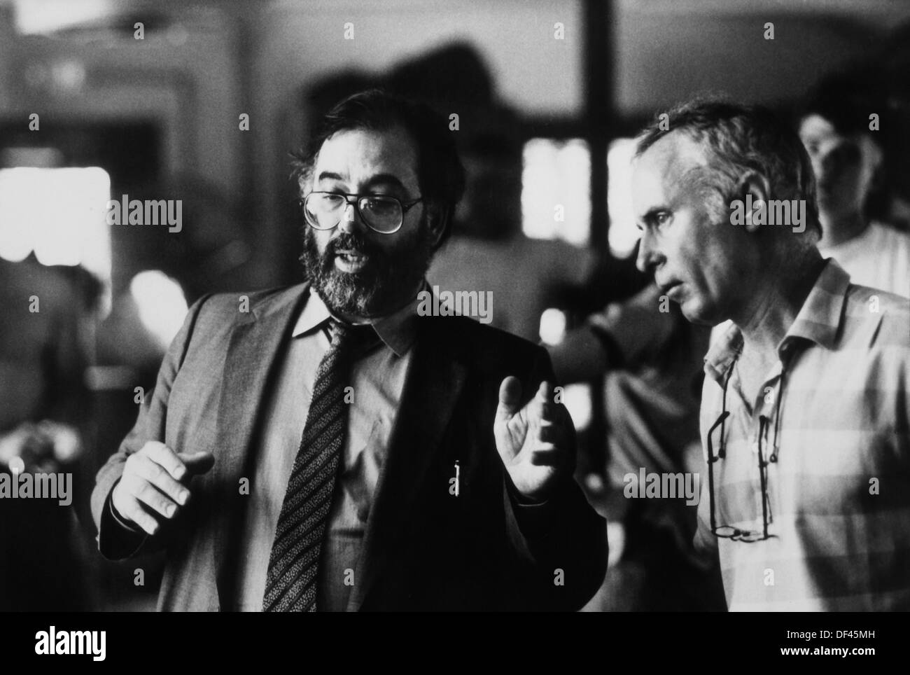 Director Francis Ford Coppola with Jordan Cronenweth, Director of Photography, on-set of the Film, 'Gardens of Stone', American Zoetrope with Distribution via TriStar Pictures, 1987 Stock Photo