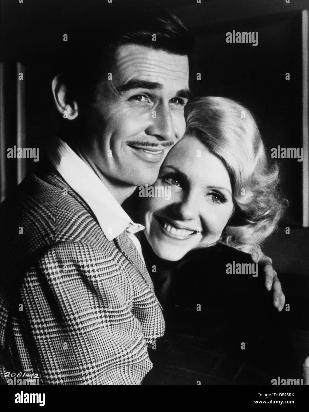 James Brolin and Jill Clayburgh in Smiling Embrace, On-Set on the Film of 'Gable and Lombard', 1976 Stock Photo