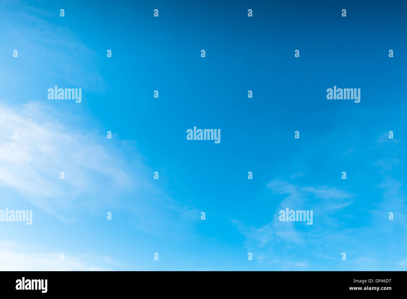 Deep Blue Sky With Clouds Stock Photo