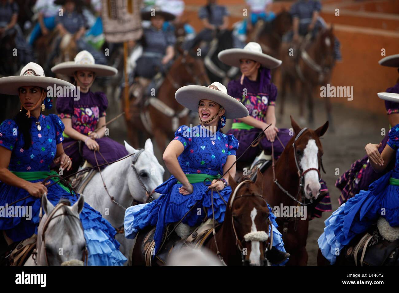 Female amazon riders ride their horses during an escaramuza fair at the ...