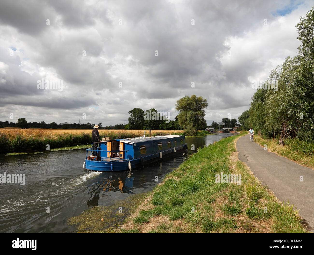 Wide beam river canal boat heading upstream to Baits Bite Lock on the river Cam Milton Cambridgeshire England Stock Photo