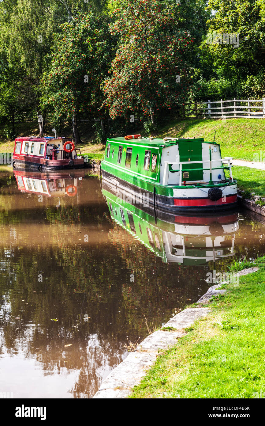 Narrowboats moored along the Monmouthshire and Brecon Canal at Llangynidr lock in the Brecon Beacons National Park. Stock Photo