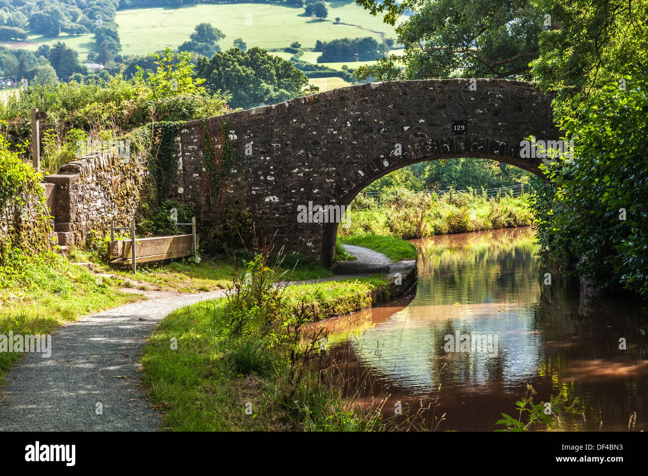 Stone bridge over the Monmouthshire and Brecon Canal at Llangynidr in the Brecon Beacons National Park. Stock Photo