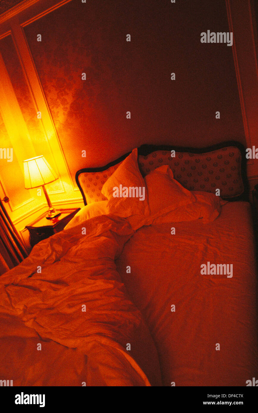 Bed in hotel room Stock Photo Alamy