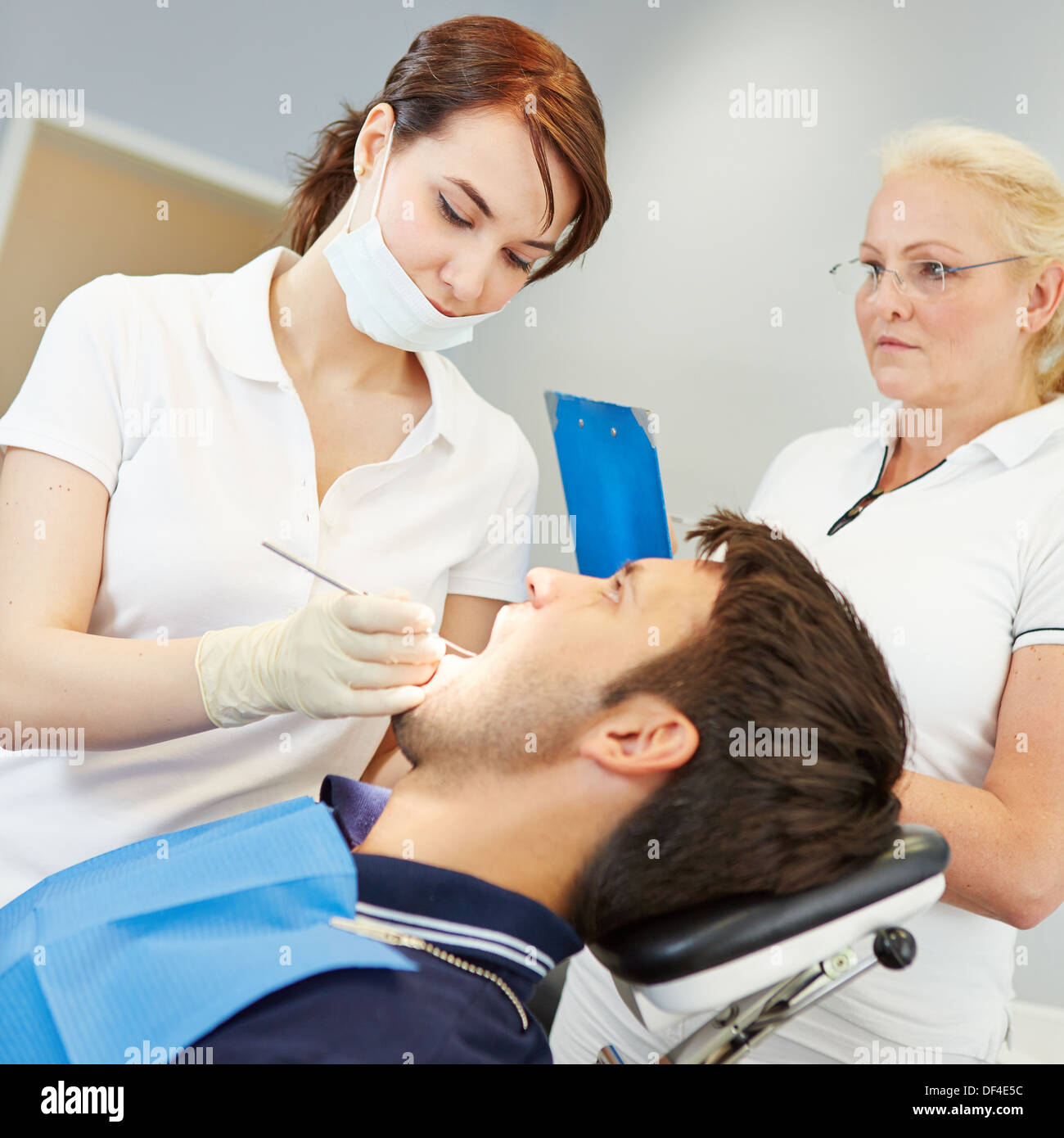 Prospective female dentist taking dental test with patient Stock Photo Alamy