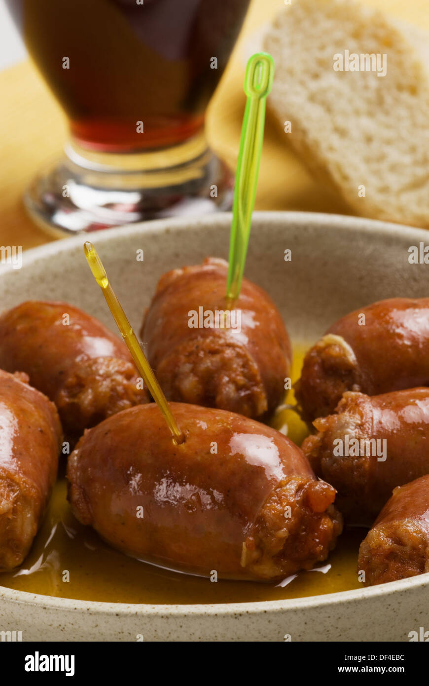 Sausages with red wine sauce Stock Photo Alamy