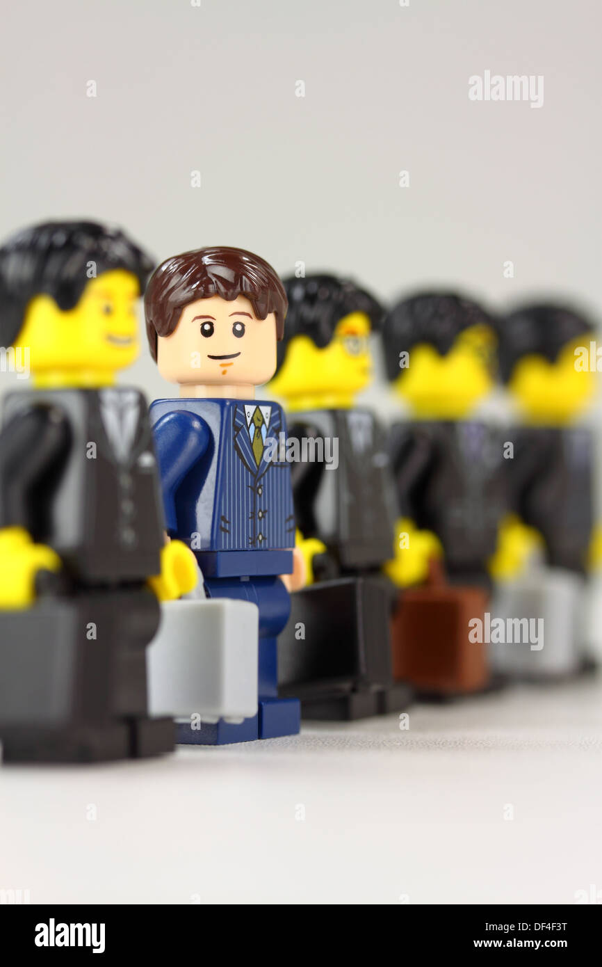 Businessman standing out from the crowd Stock Photo