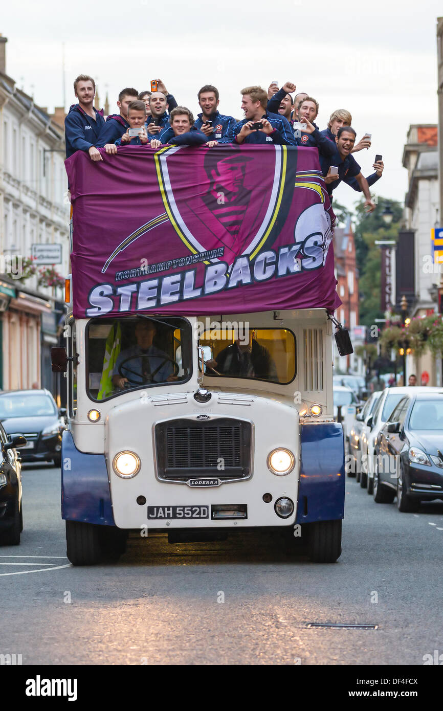 Northampton, UK . 27th Sep, 2013. The Steelbacks, Northamptonshire County Cricket Team parade the Friendslife T20 trophy through the Town Centre to a civic reception at the Guildhall. The team set off from the county ground at 6.15pm in an open-top bus and parade the T20 trophy through St Giles Street before arriving at the Guildhall for the reception.The Steebacks have completed one of the most successful seasons in the team’s history. Credit:  Keith J Smith./Alamy Live News Stock Photo