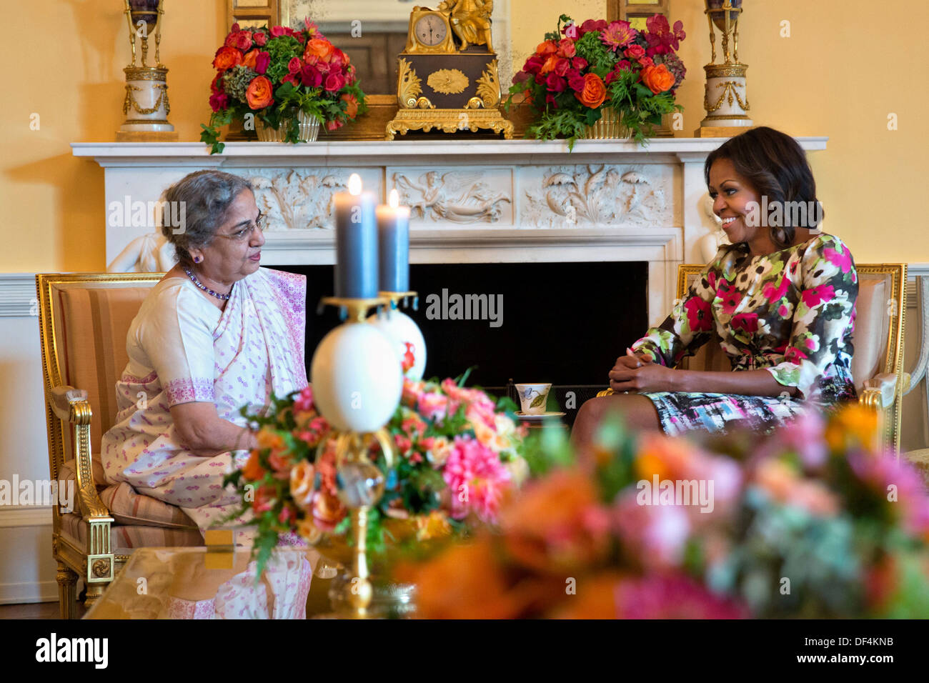 Washington DC, USA. 27th Sep, 2013. US First Lady Michelle Obama hosts a tea for Mrs. Gursharan Kaur, wife of Prime Minister Manmohan Singh of India, in the Yellow Oval Room of the White House September 27, 2013 in Washington, DC. Credit:  Planetpix/Alamy Live News Stock Photo