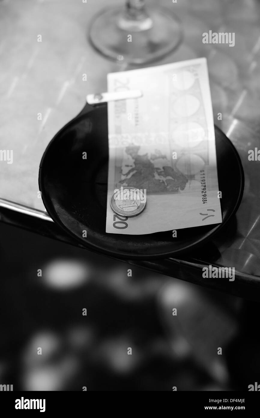 Money in Tray on Restaurant Table Stock Photo