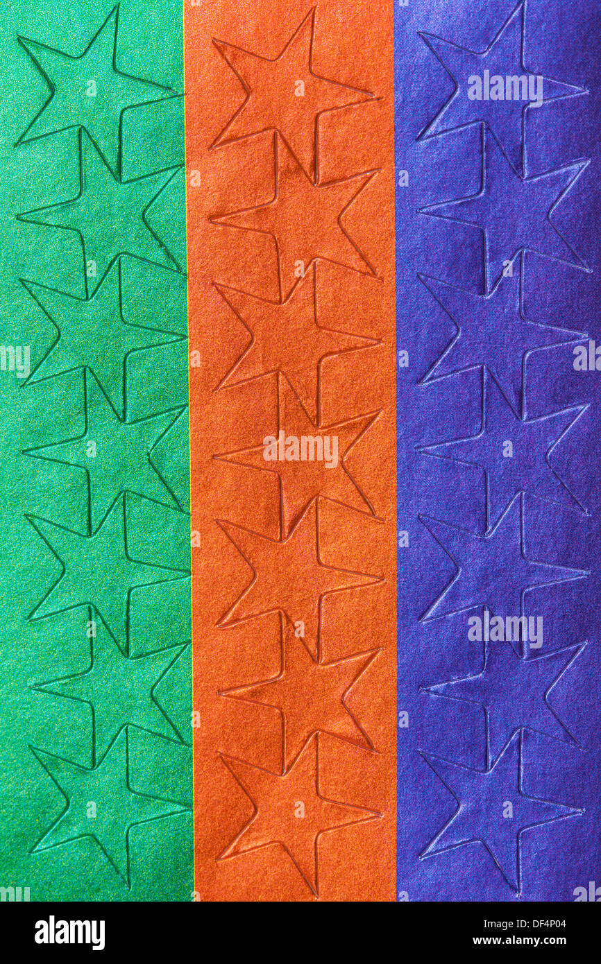 Sheet of colorful star stickers in extreme closeup, studio Stock Photo