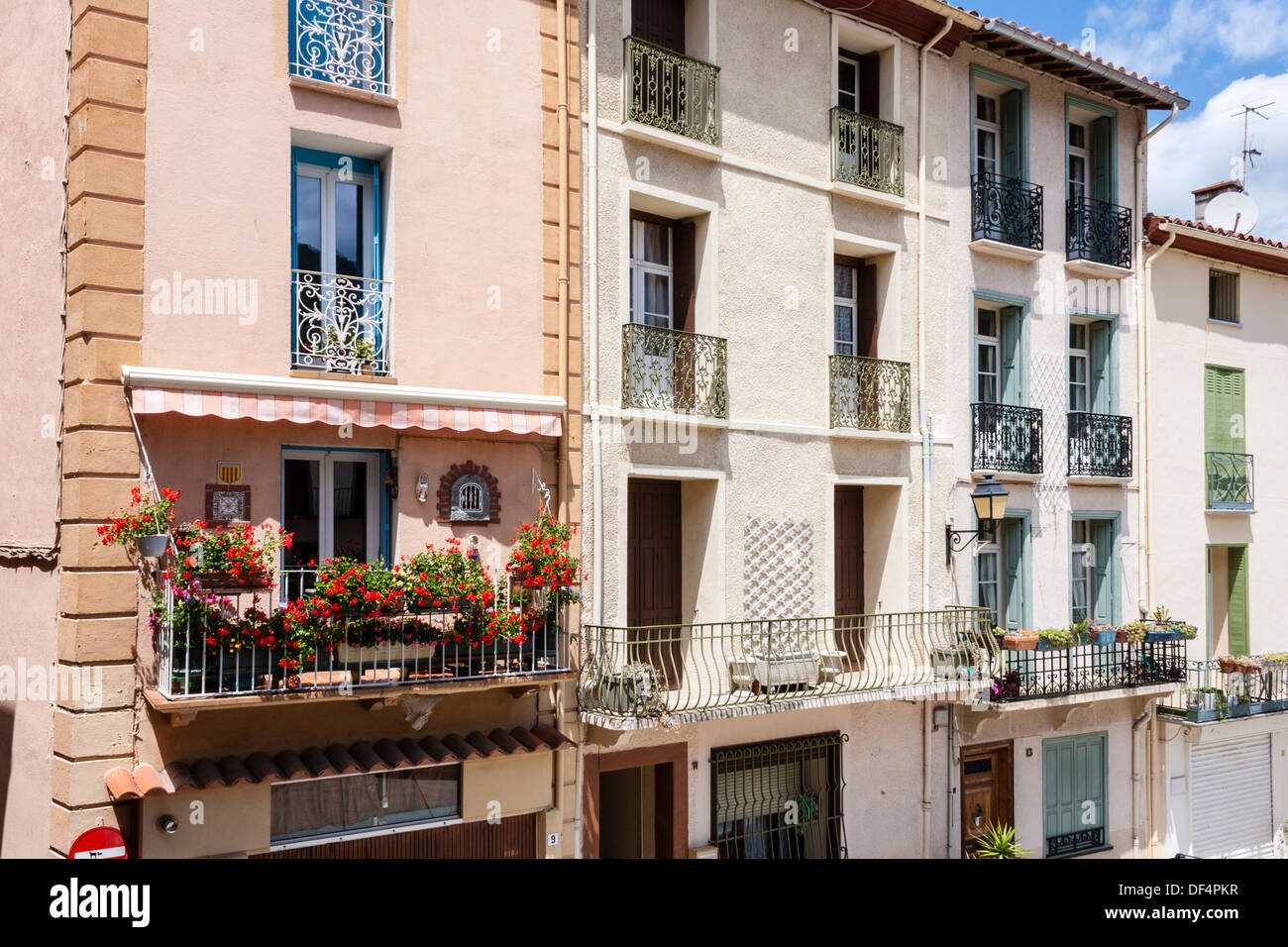 Multistorey houses in narrow alleyway in Arlessurtech Stock Photo