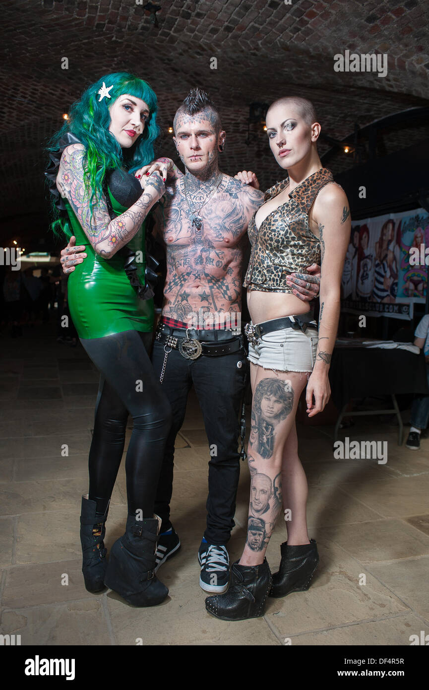 Wapping, London, UK. 27th Sept, 2013. Tattoo models Melissa Hayward (L) and Maja Stina ® with tattooist and body piercer Baz Black © Terence Mendoza/Alamy Live News Stock Photo