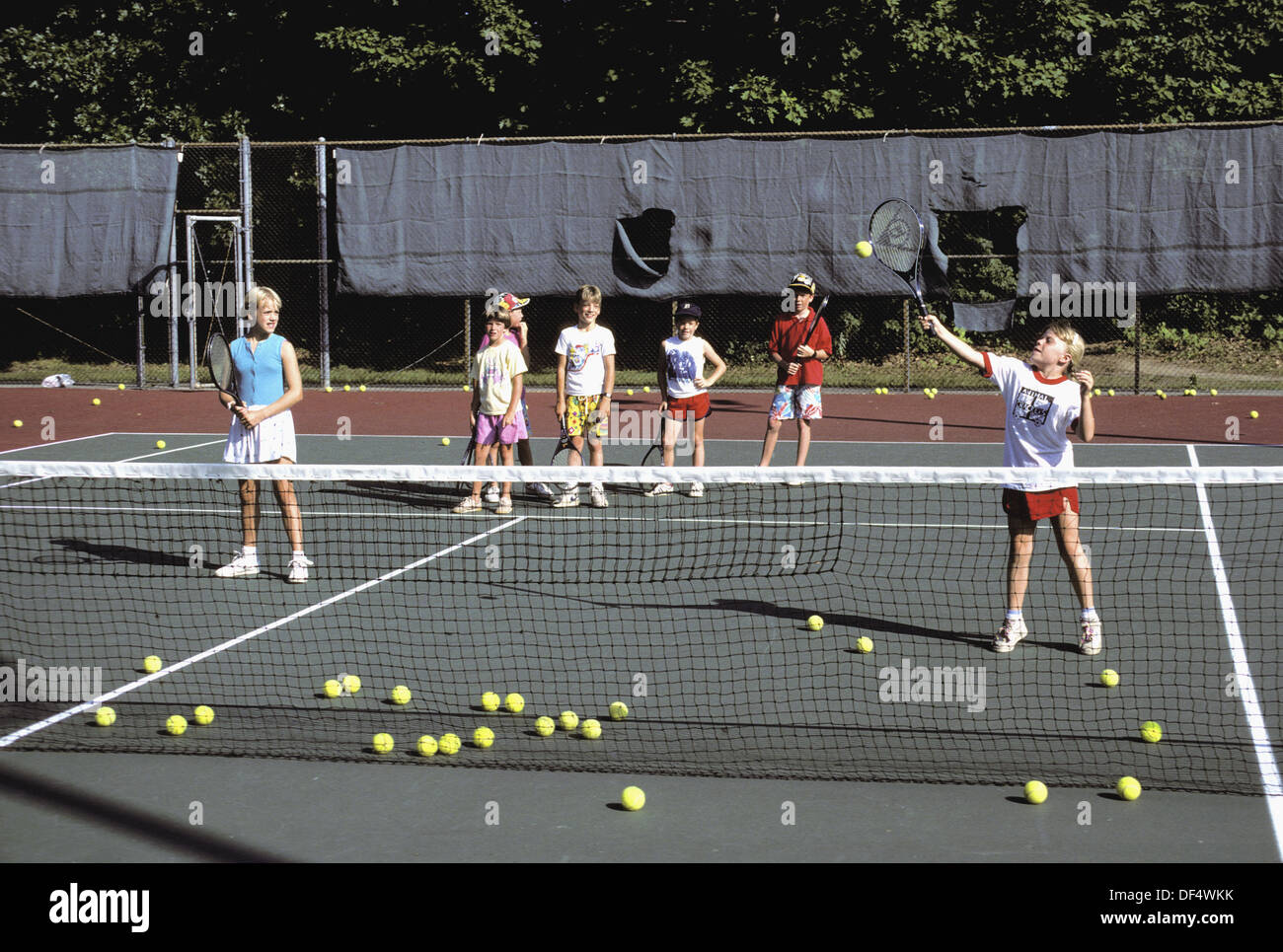Tennis lesson with children ages 48 Stock Photo Alamy