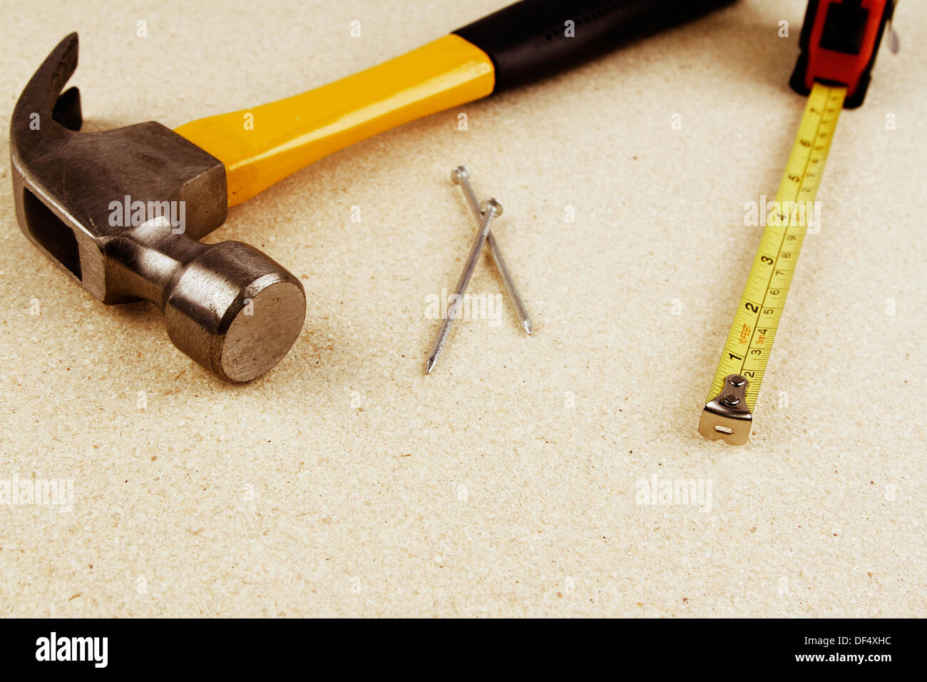 Hammer, nails and tape measure. Stock Photo