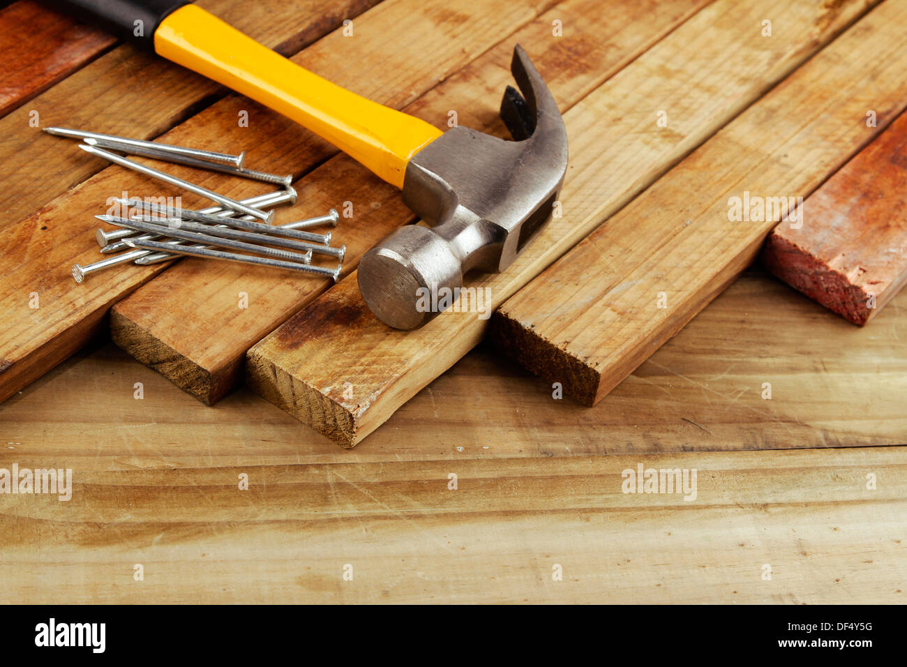 Hammer and nails on wood Stock Photo Alamy