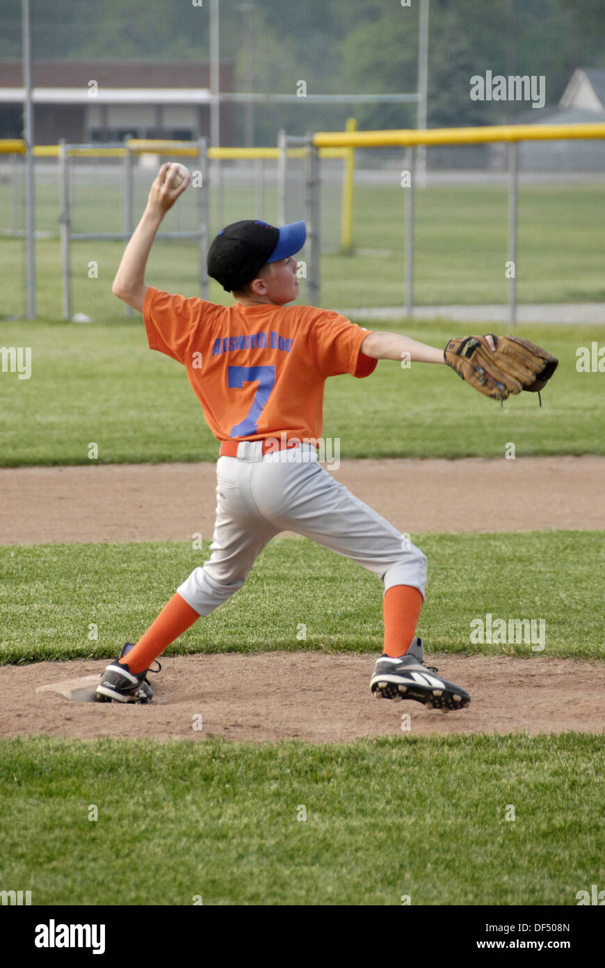 Little League baseball pitcher player throwing a baseball Stock Photo