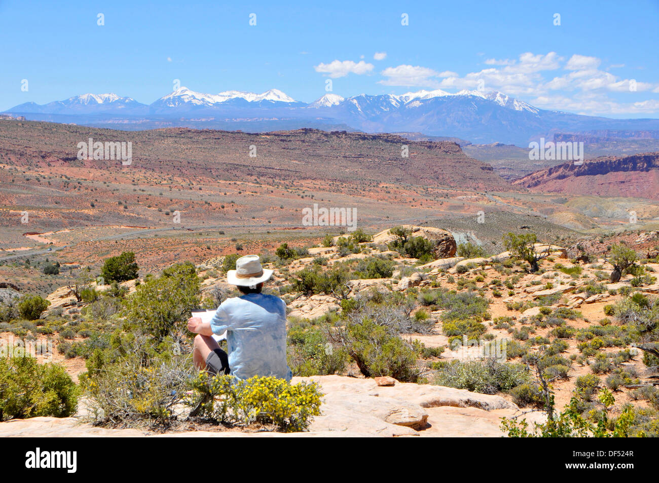 Visitor at Fiery Furnace overlooking Salt Valley Arches National Park