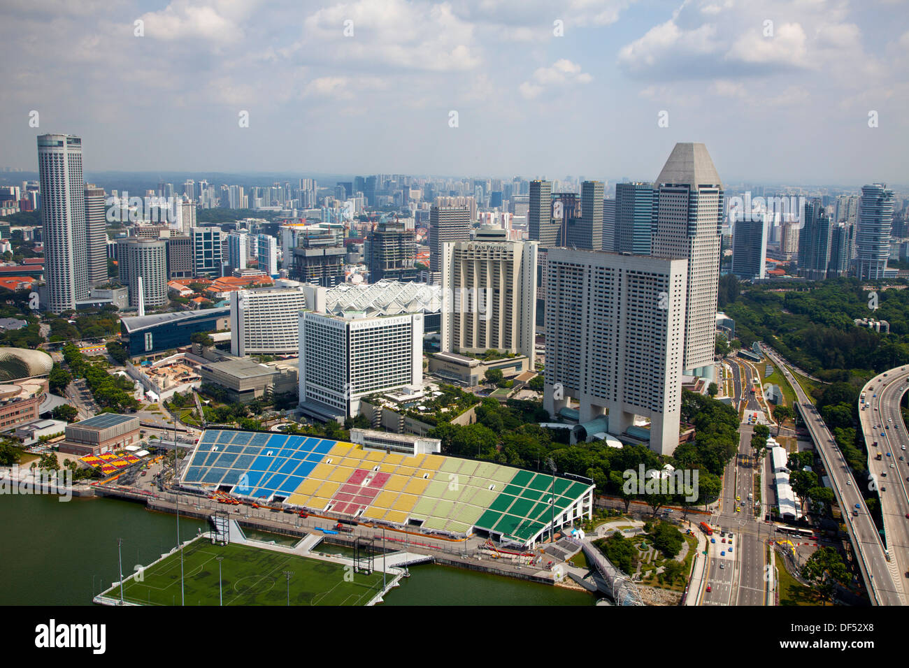 Marina Bay view above Singapore Asia skyscrapers soccer field buildings power influence elevated architecture money center town Stock Photo