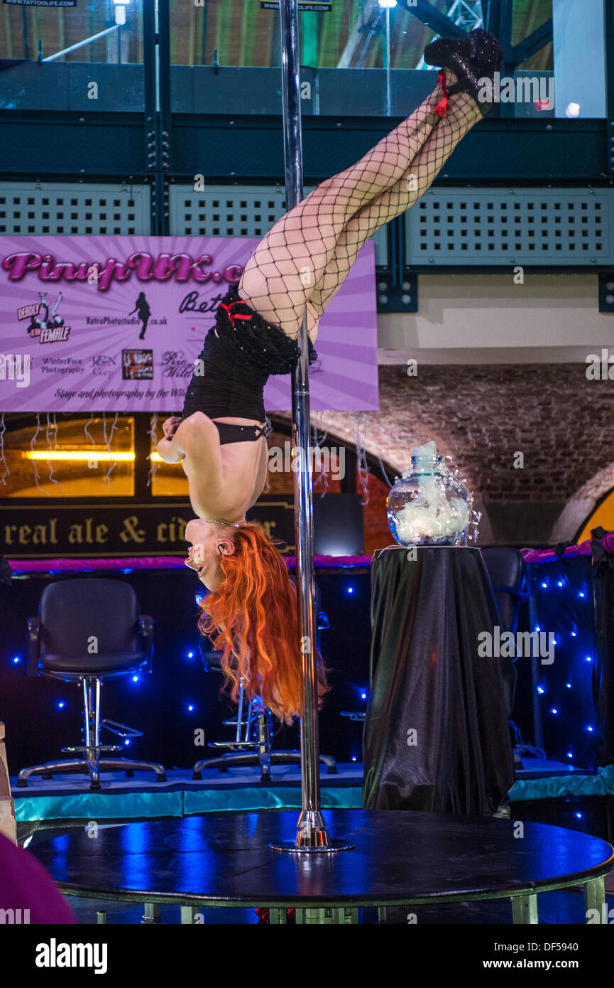 Burlesque artist  performing at the pin-up stage at the London Tattoo Convention. Stock Photo