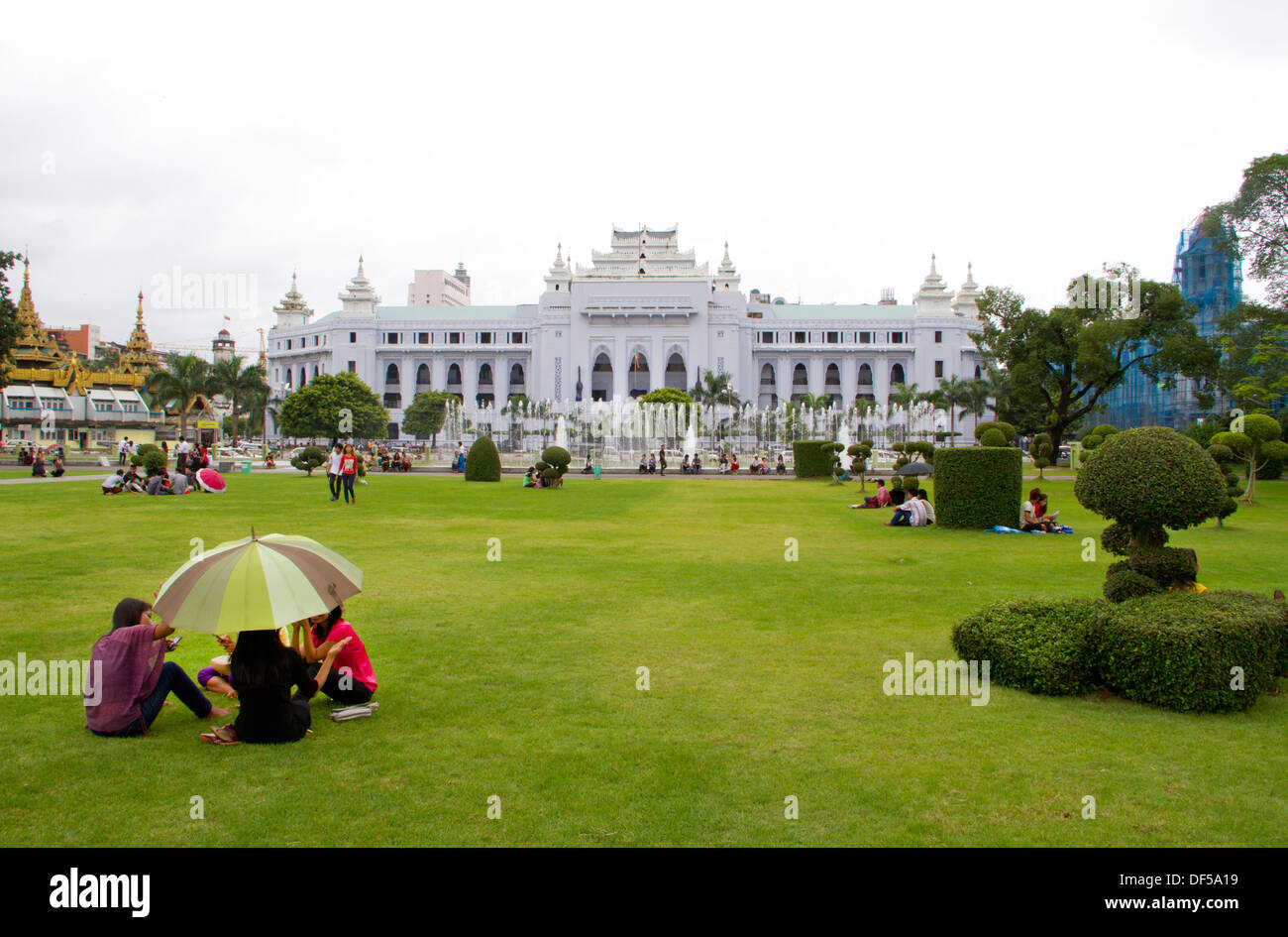 People relax in Mahabandoola Garden Park in Yangon, Burma. Stock Photo