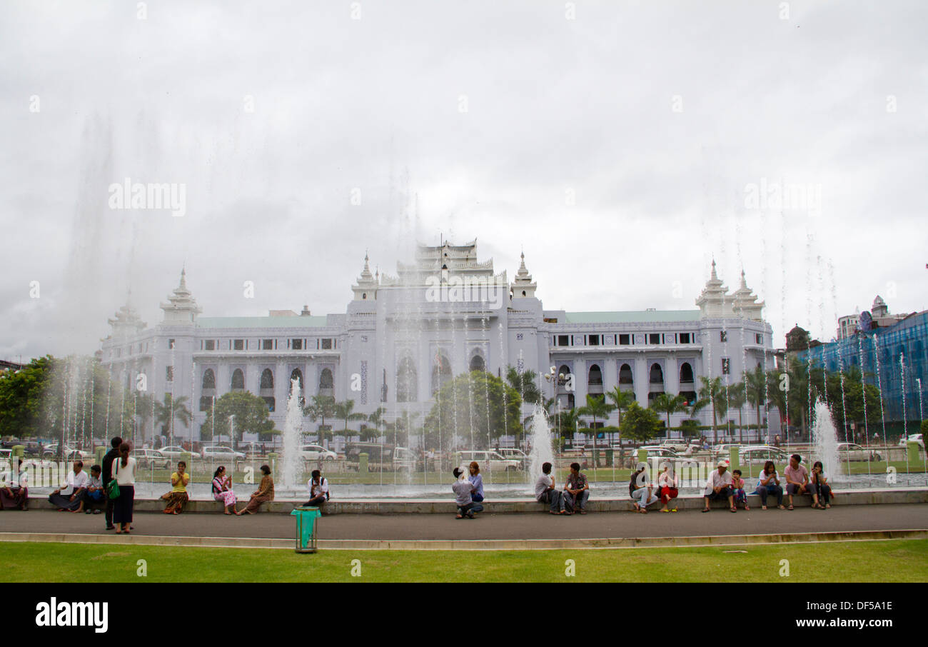 People relax in Mahabandoola Garden Park in Yangon, Burma. Stock Photo