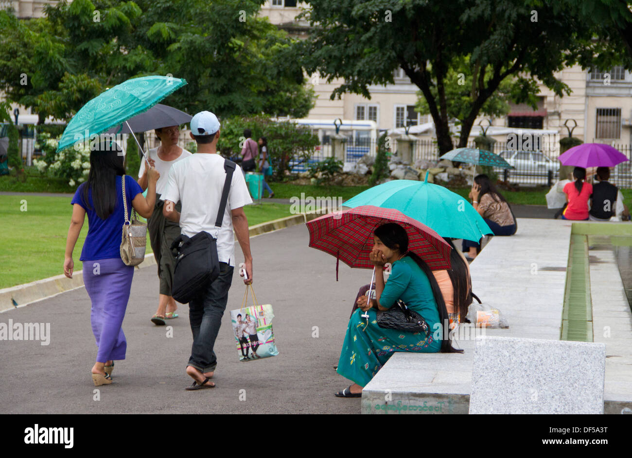 People relax in Mahabandoola Garden Park in Yangon, Burma. Stock Photo