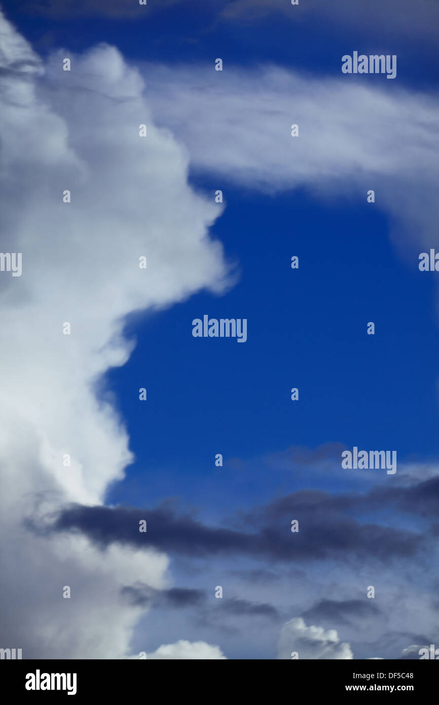 Deep blue sky background with storm clouds. Cloudy sky full of gray