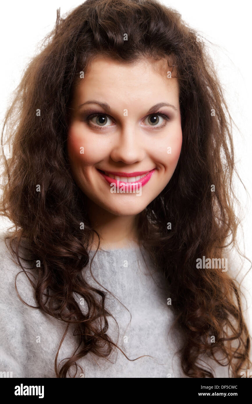 Portrait of beautiful young happy smiling girl long curly hair isolated ...