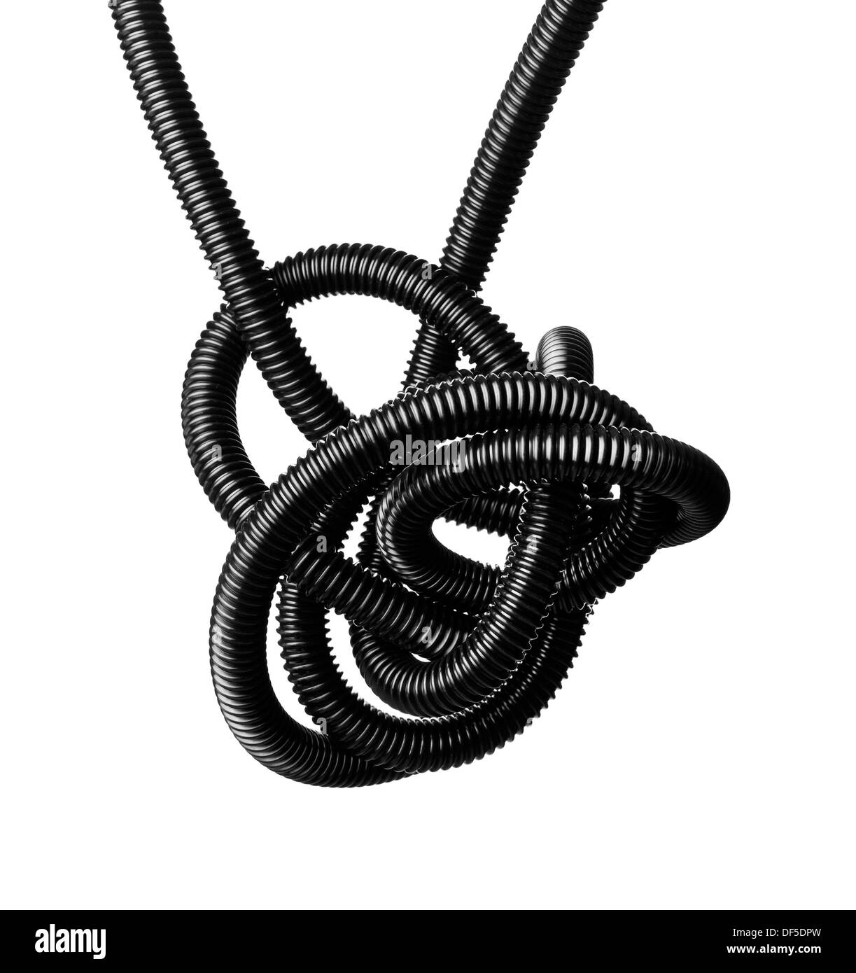 Black and white image of a black tangled flexible hose. Stock Photo