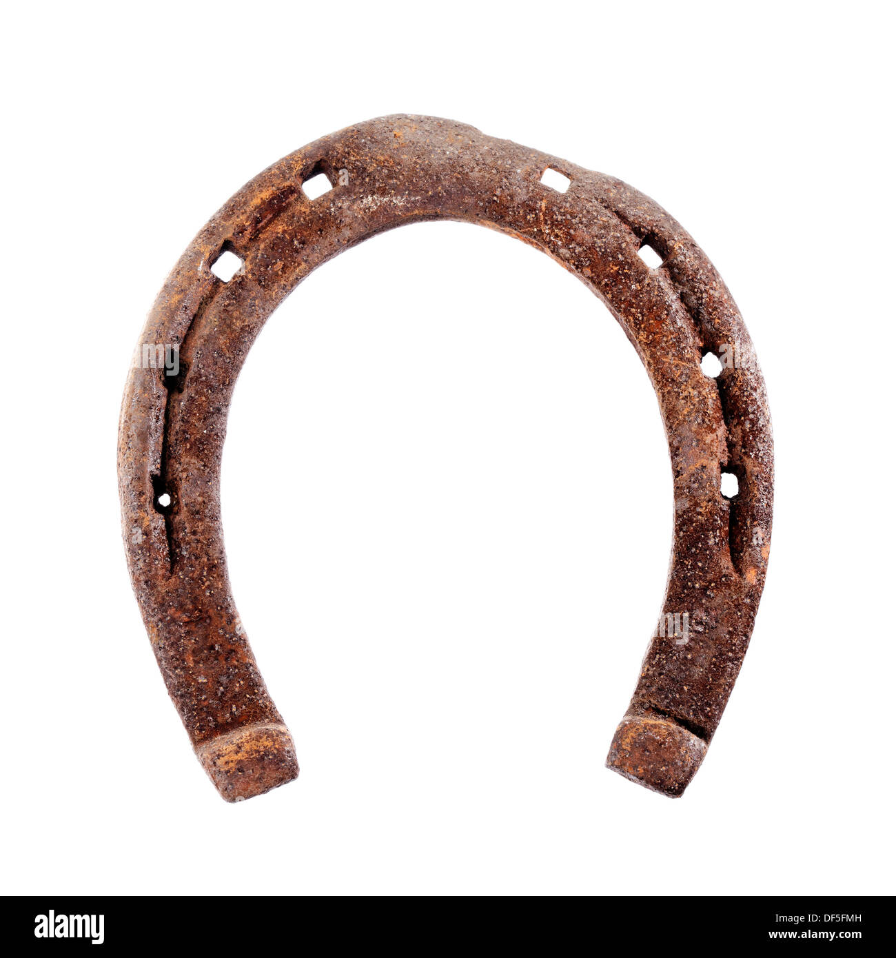 Old rusty and worn horseshoe isolated on white. Stock Photo